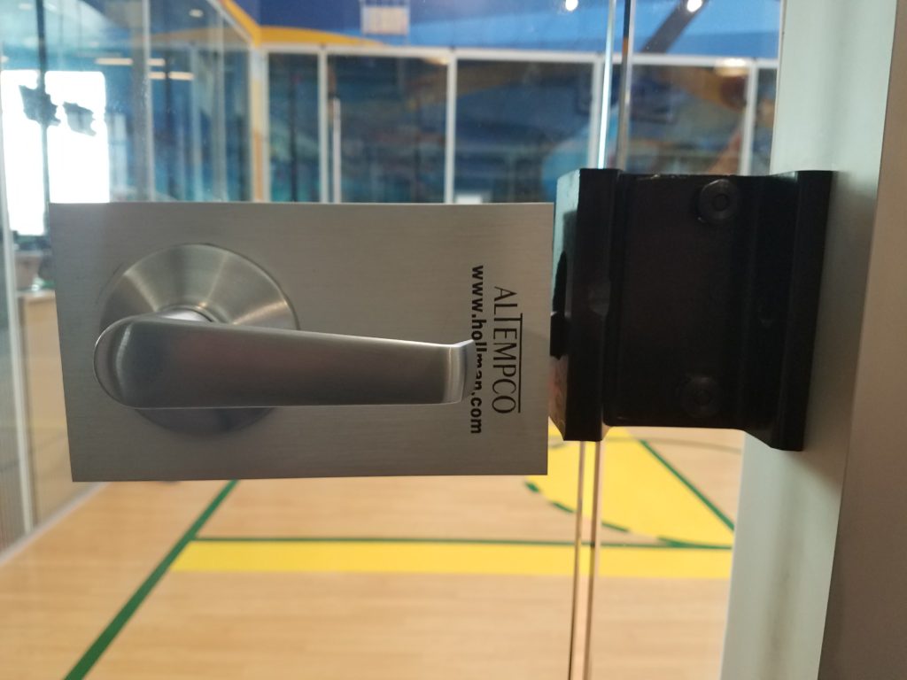 Commercial lever handle lock installed on a glass interior door by Mile High Locksmith® in Denver.