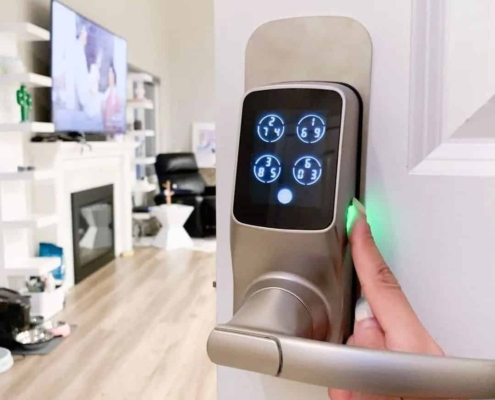 Smart door lock with a camera installed on a front door, providing keyless entry and remote access for homeowners in Denver, Colorado Springs, and Fort Collins.
