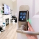 Smart door lock with a camera installed on a front door, providing keyless entry and remote access for homeowners in Denver, Colorado Springs, and Fort Collins.