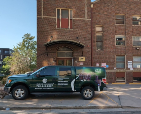 Mile High Locksmith® mobile service van parked outside 190 E 9th Ave in Denver, providing emergency, residential, and automotive locksmith services.