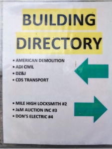 Directory sign listing Mile High Locksmith® in Suite 2 at 401 N Kuner Rd, Brighton—confirming our office location for mobile locksmith service near you.